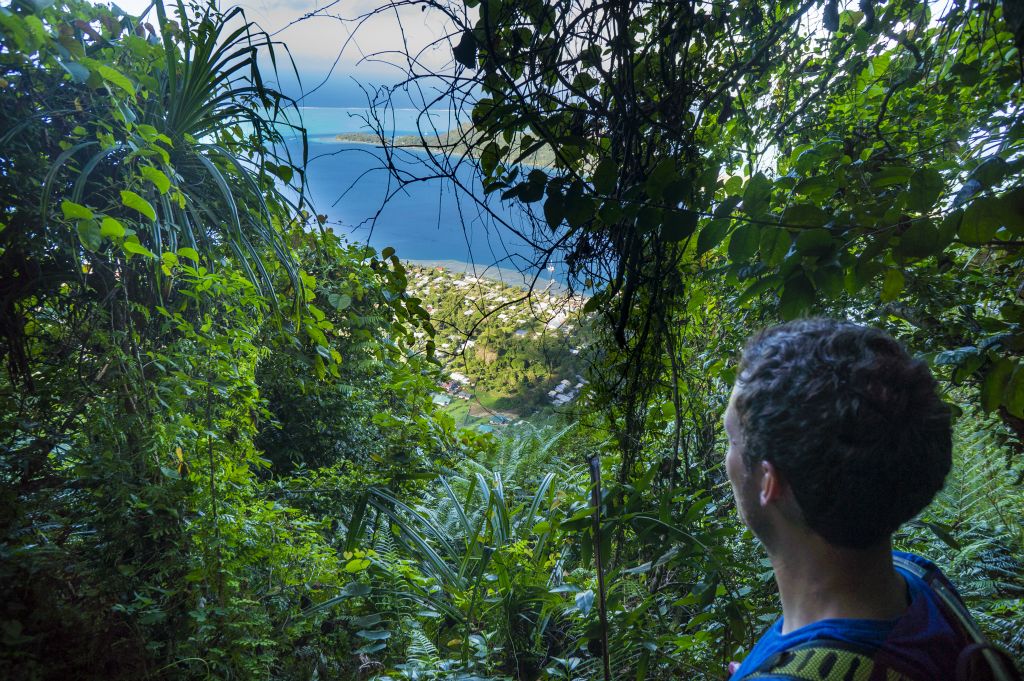 A break in the canopy allows Josh to get a view of Vaitape and the lagoon far below: